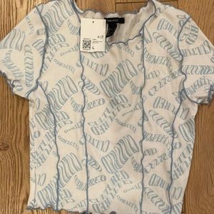 Forever 21 cropped white and blue shirt. Never been worn tags still on.